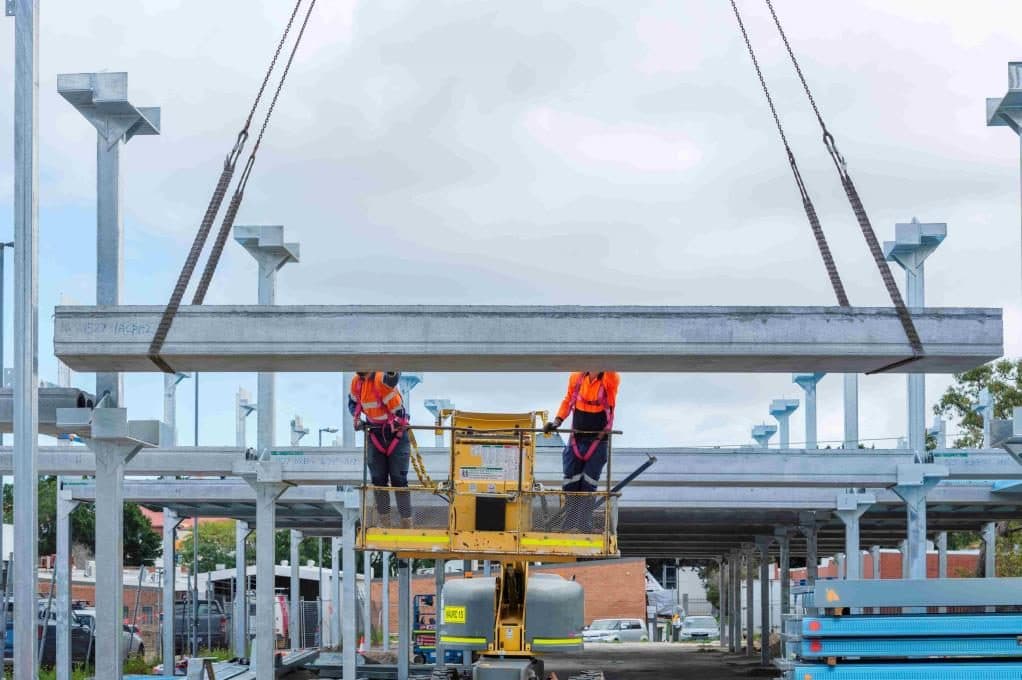 Crews installing a prefabricated PARKD deck module on site